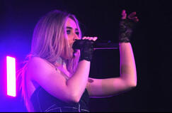 sabrina carpenter, performing on stage.