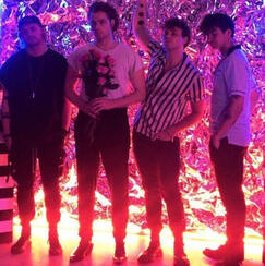 5 seconds of summer, posing together. from left to right: michael clifford, luke hemmings, ashton irwin, calum hood.